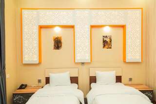 Отель Marsel Hotel Баку Четырехместный номер с видом на сад-2